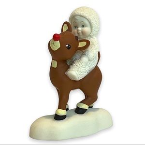 Snowbabies Figurine of a Child Riding Rudolph the Red Nosed Reindeer